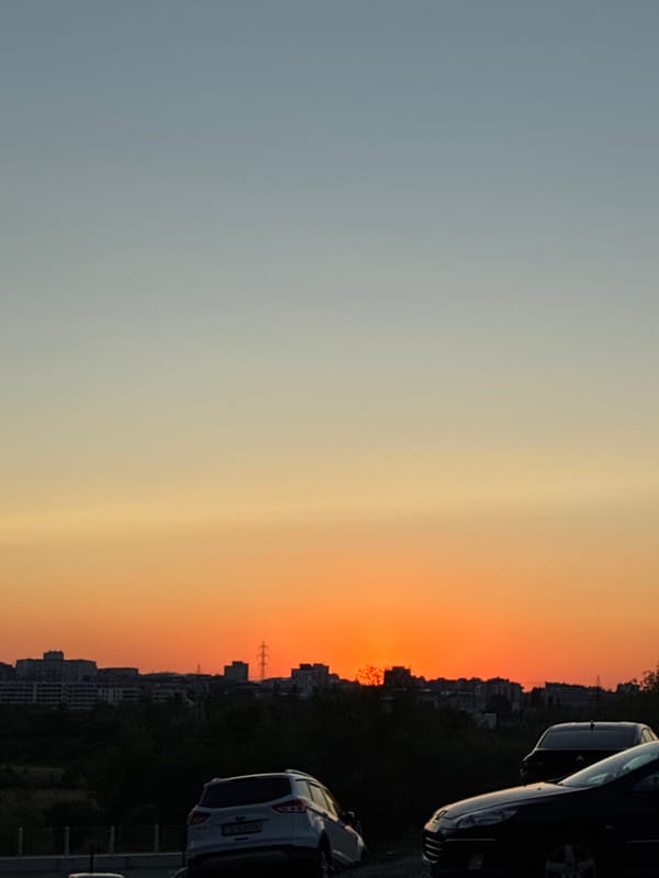 Sunset over Sofia's skyline, shot from above at golden hour