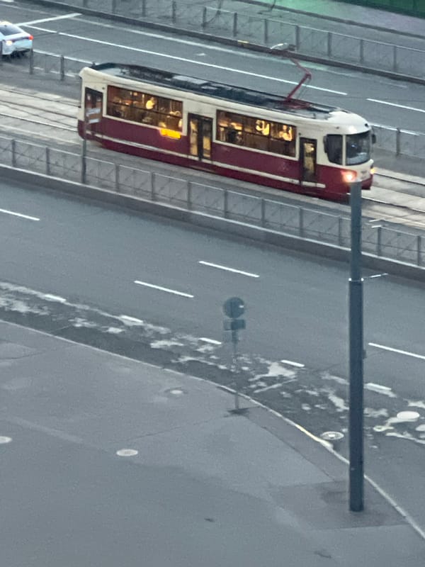 Trams, dusk skylines, and cafe murals in a Russian city