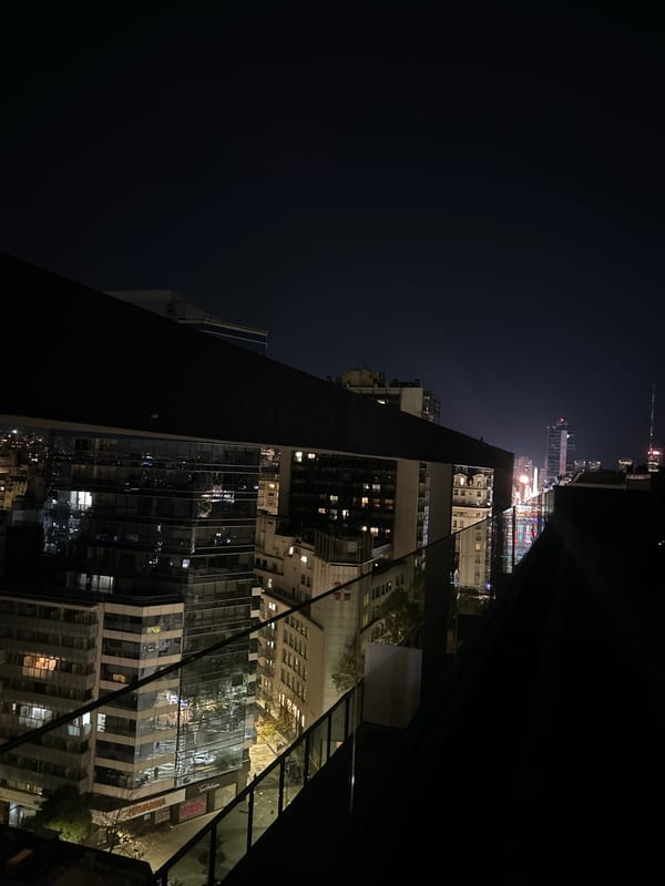 Nighttime Buenos Aires cityscape documented from high-rise vantage point