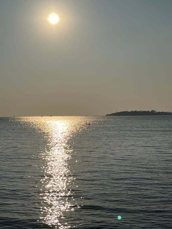 Golden sunset over calm coastal waters in Jepara, Indonesia