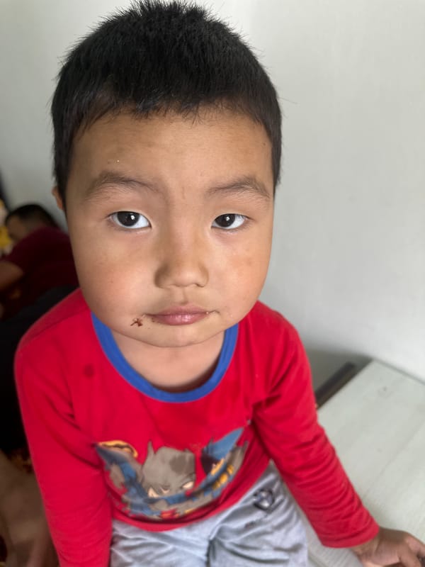Two kids, a quiet morning at home in Kyrgyzstan