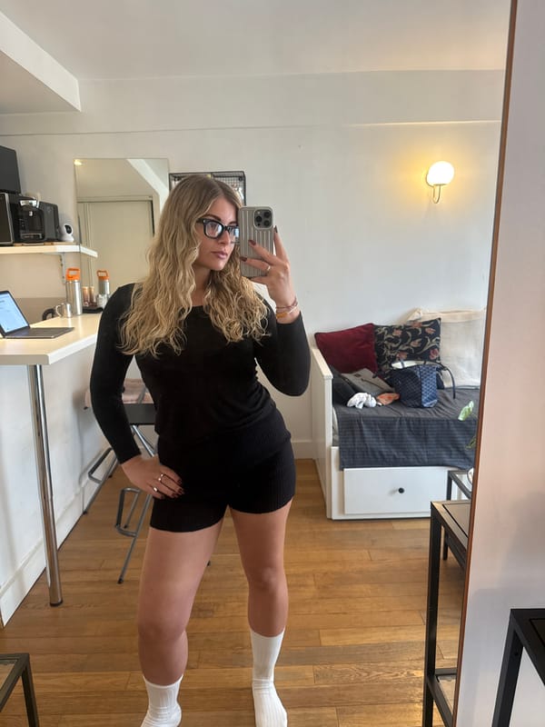 Woman takes selfies in Paris apartment
