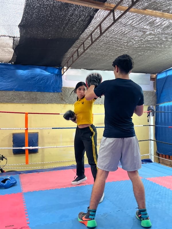 Boxing training and street repair work happening across Arica