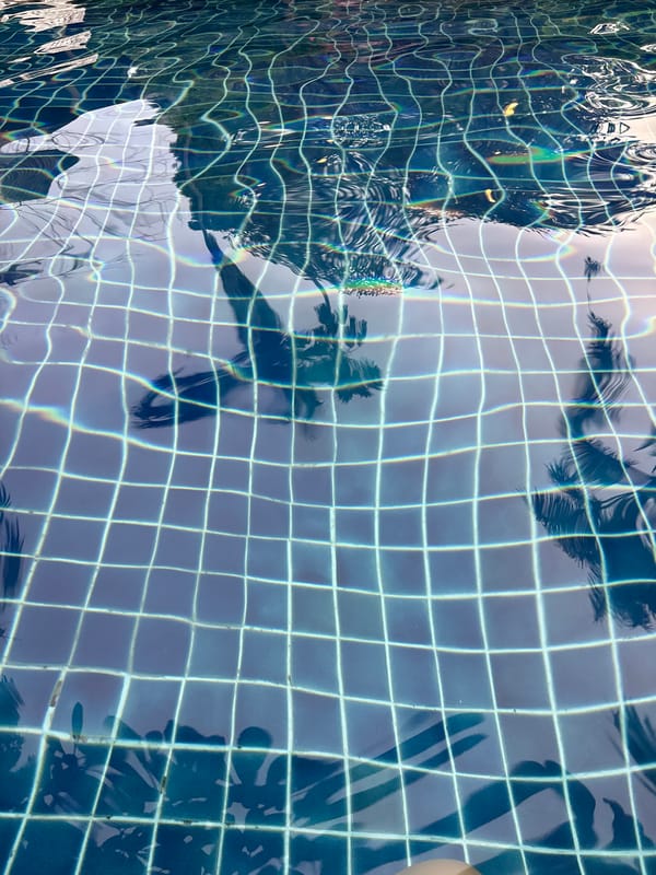 Lazy morning at a tropical resort pool in Wichit
