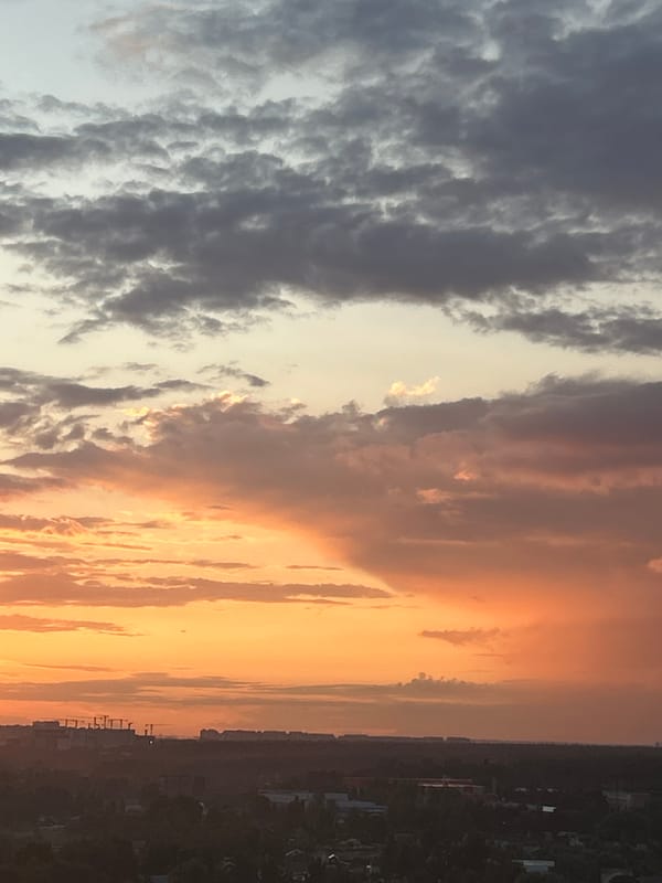 Vivid summer sunset over Ivanteyevka apartment blocks