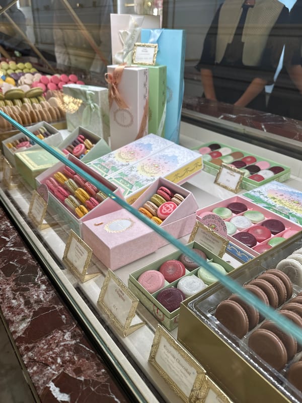 Colorful macarons and decorative boxes on display in Paris