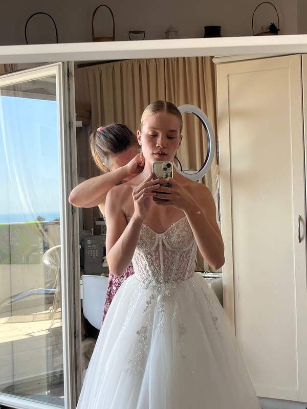 Bride-to-be tries on wedding dresses in Budva Montenegro