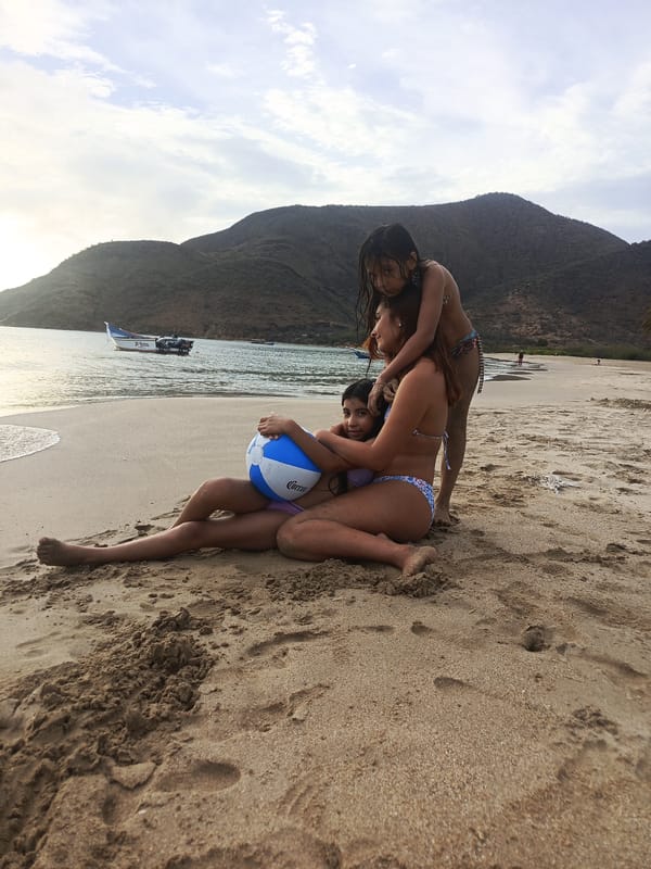 Family beach evening at Juan Griego as the sun goes down