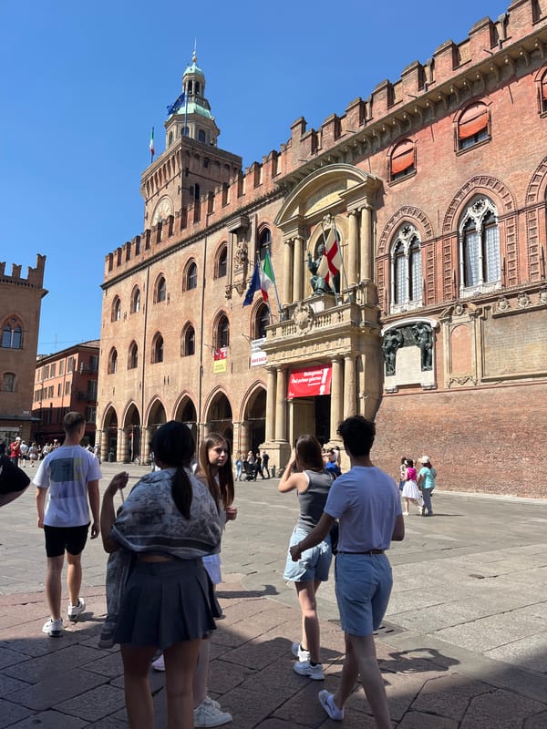 Morning life unfolds across Bologna's historic squares and landmarks
