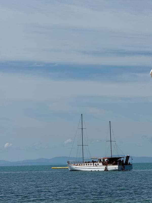 Group out on a sailboat, calm seas, leisure mode