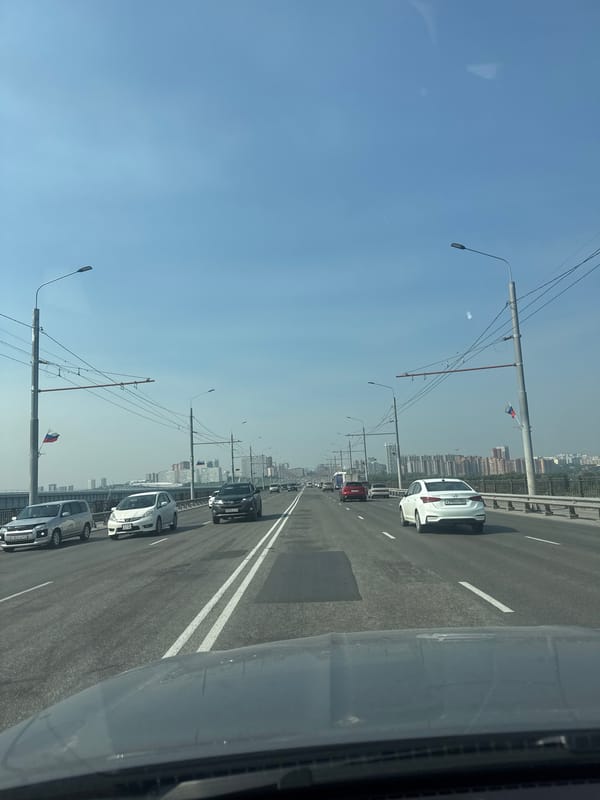 Driving across a Novosibirsk bridge on a clear day
