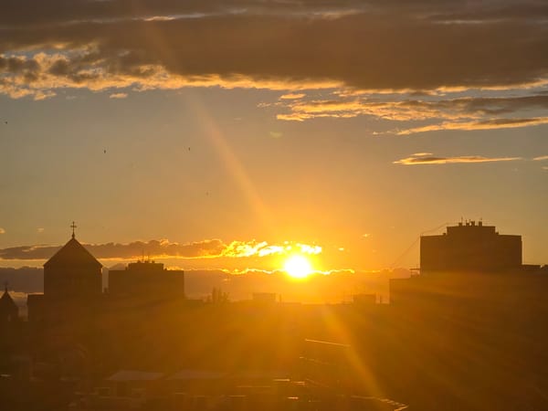 Witness documents sunset to nighttime transition across Yerevan, Armenia