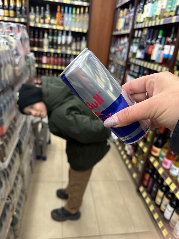 Person holds Red Bull in Russian store