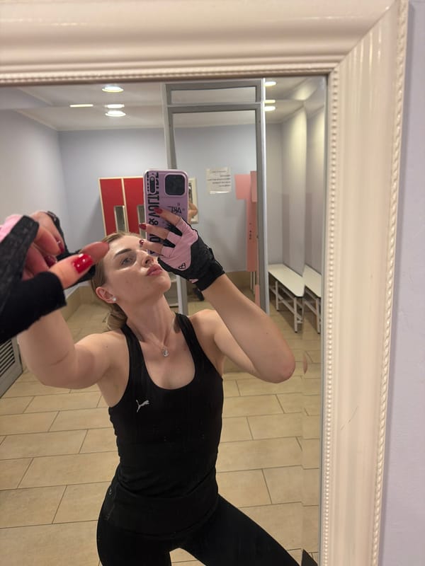 Post-workout locker room selfies with gloves and water bottle