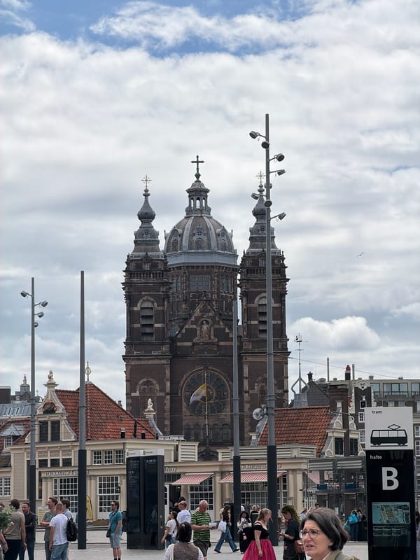 Amsterdam's central tourist corridor on a busy overcast morning