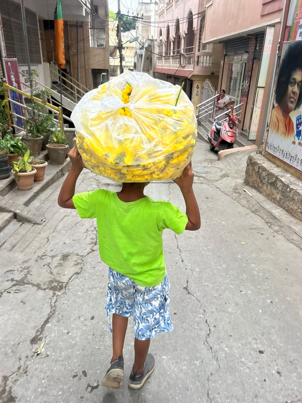 Morning street life and flower vendors in Puttaparthi, India