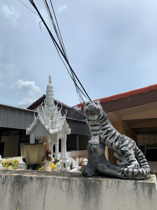 Colorful vehicles and street decor in Ban Bang Rak, Thailand