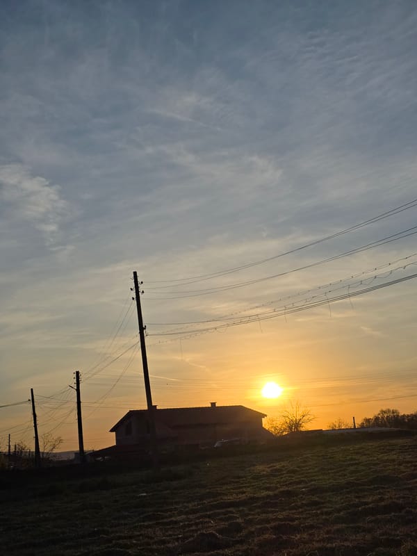 Golden hour sunset illuminates peaceful Bulgarian countryside near Drazhevo