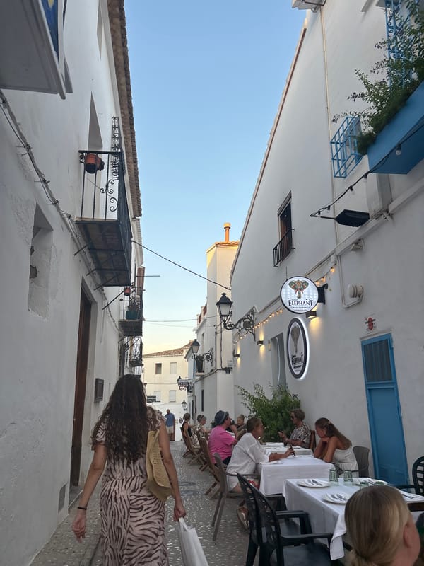 Altea street gathering at golden hour