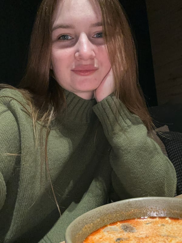 Young woman enjoys morning meal in Chaikovsky, Russia