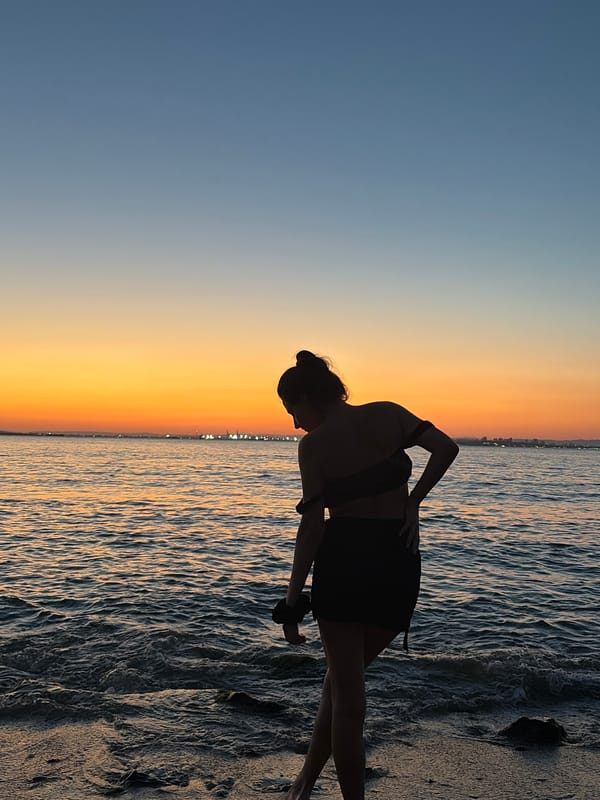 Silhouette at the Black Sea shore during golden hour sunset.