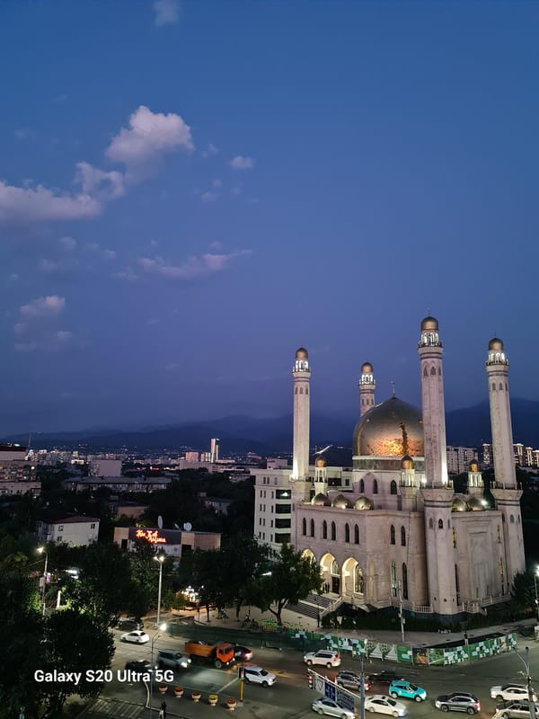 Almaty's Central Mosque glowing at dusk, multiple angles
