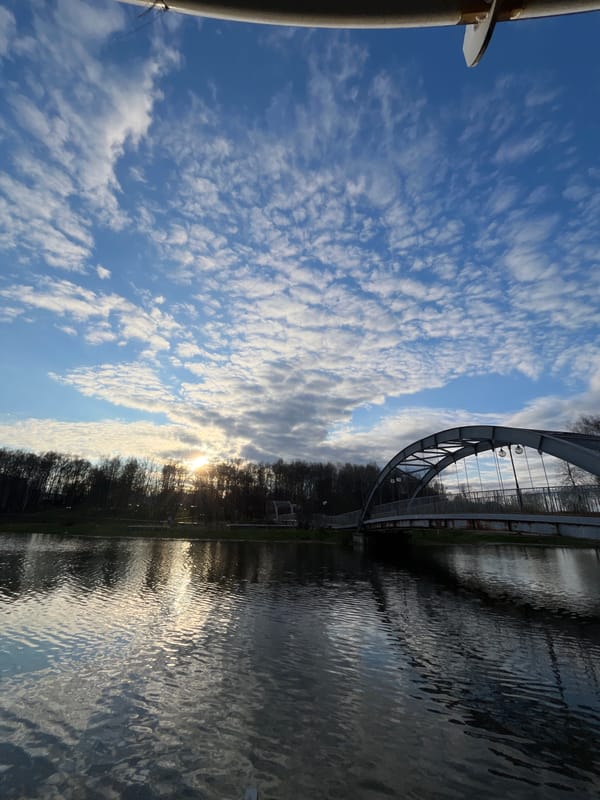 Woman photographs herself along Sestra River in Klin, Russia