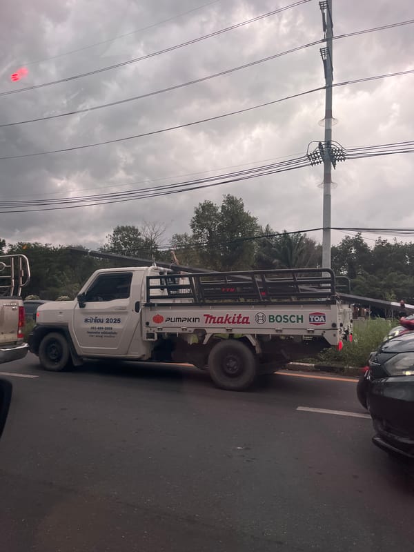 Traffic jam forms under storm clouds in Si Sunthon