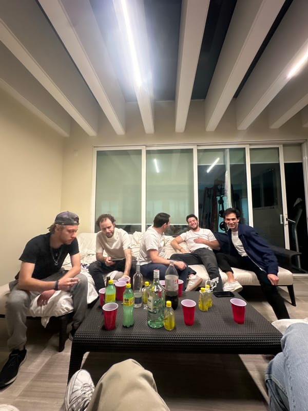 Five young men gather indoors in Santiago Yancuitlalpan