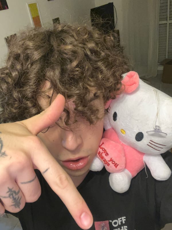 Person poses with Hello Kitty toys in Argentina bedroom