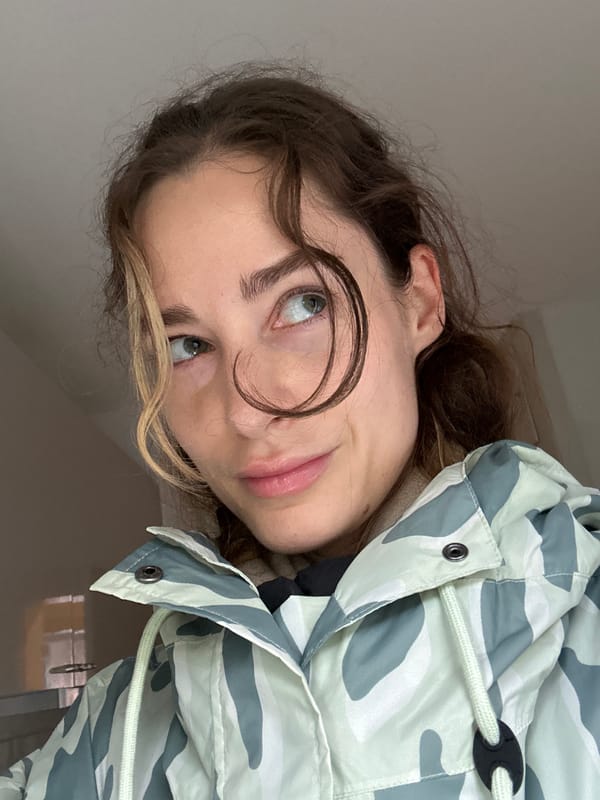 Woman in camo jacket photographed with pie in Kiel