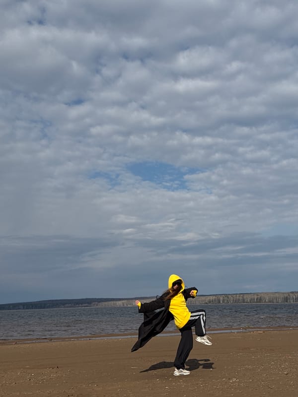 Person walks and poses on beach in Chaikovsky, Russia