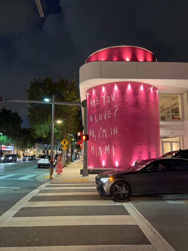 Pink cylindrical building displays love message in Miami streets