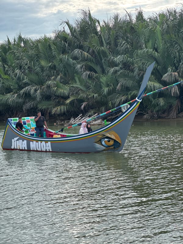 Traditional boats and river life along Reudeuep's calm waterways