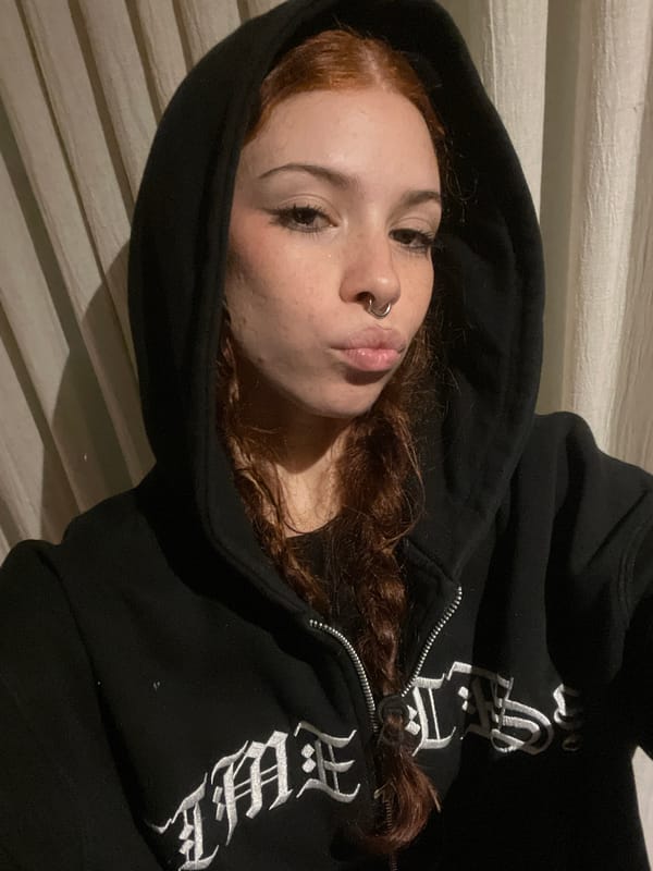 Person in hooded sweatshirt observed indoors in Buenos Aires