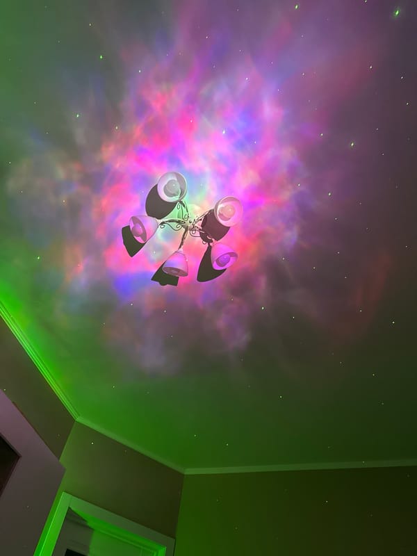 Ceiling fan creates colorful light patterns in indoor setting