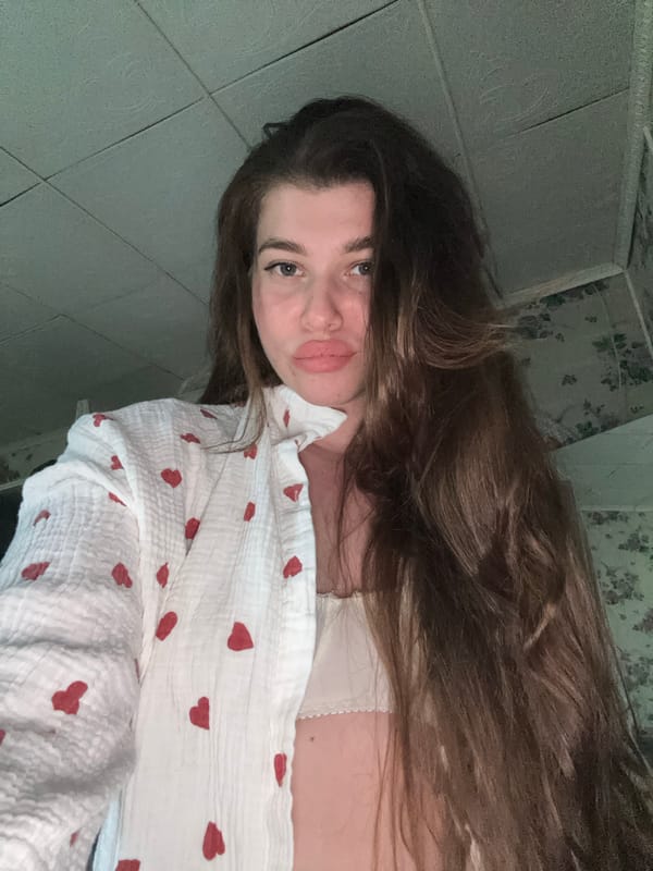 Woman photographs herself in bathroom in Мещёры, Russia