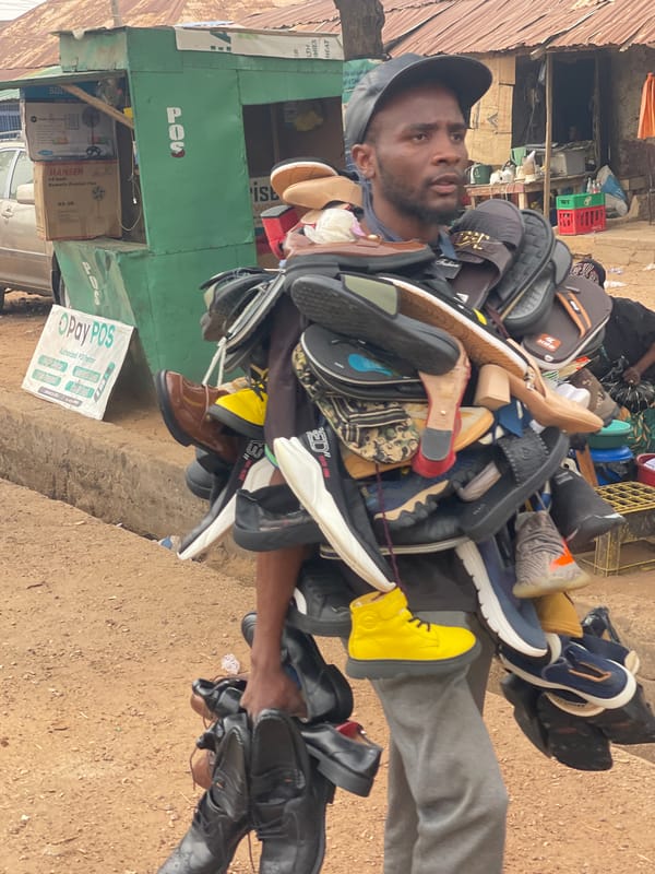 Shoe vendor photographed at Zaria street market