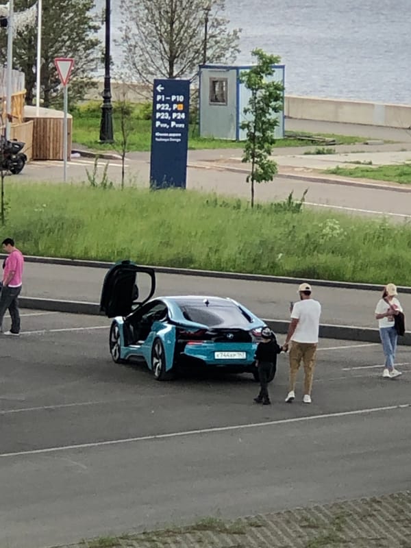 Mixed urban scenes across Russia featuring cars, waterfront views, street life