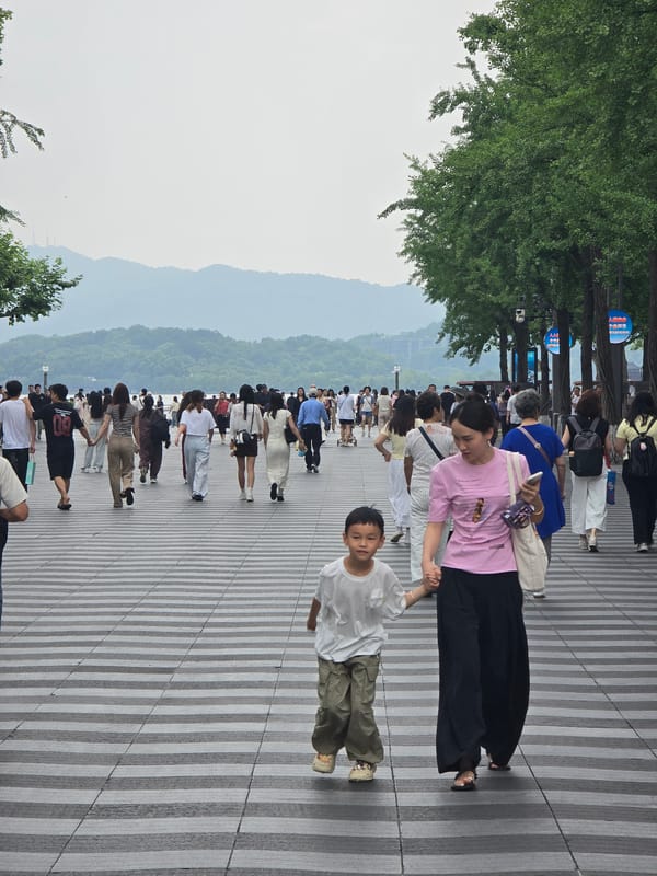 Morning crowds gather around Apple Store in Shangcheng District
