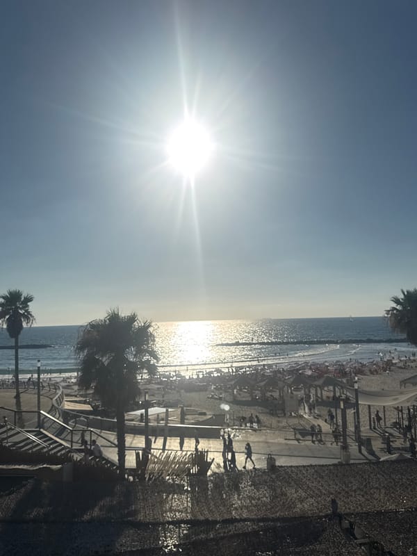Bright afternoon sun and shade on a Tel Aviv beach