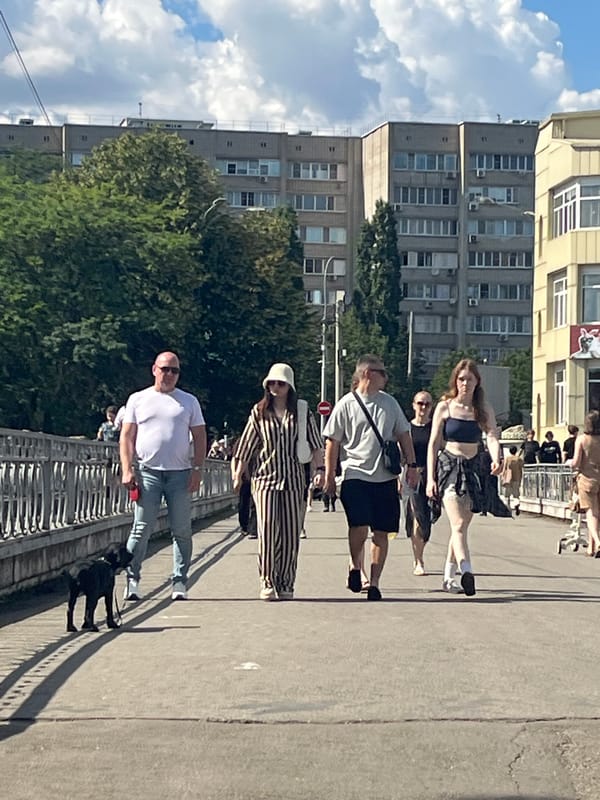 Krasnodar locals fill the waterfront park on a sunny afternoon