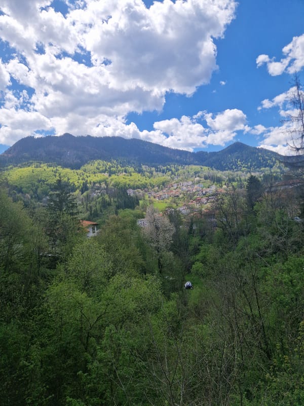 Hillside village observed amid mountains in Smolyan, Bulgaria