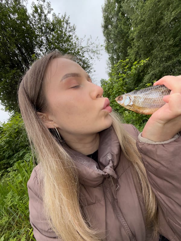 Family fishing trip catches small red-finned fish near Zhigalki