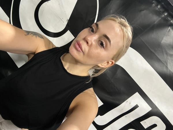 Woman photographed during fitness session in Megion boxing gym