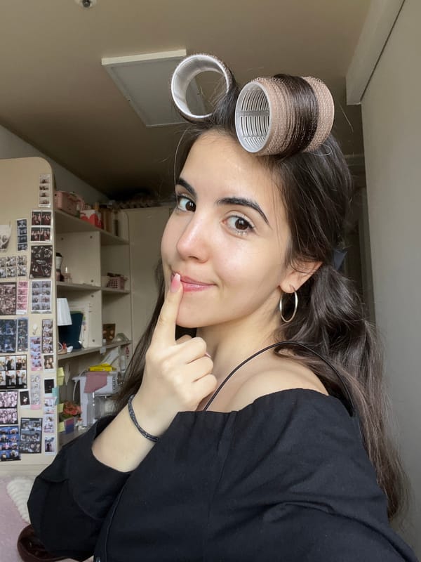 Woman in hair rollers photographed indoors in Daegu