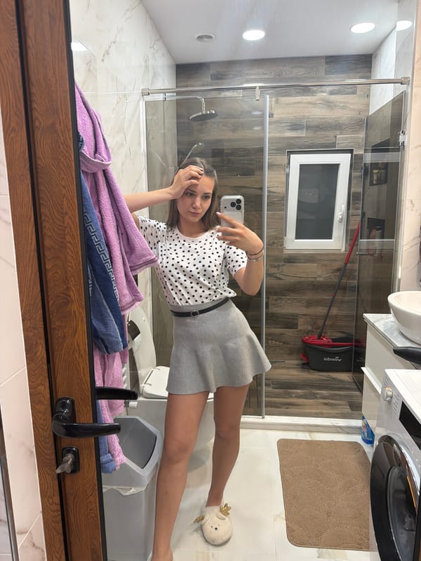 Woman takes bathroom selfies in Buhovo, Bulgaria