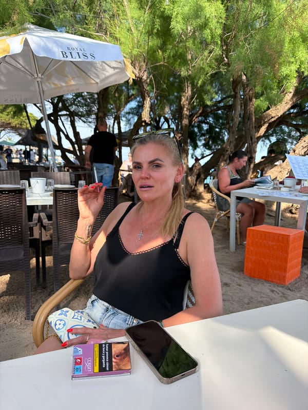 Woman dines at beachfront restaurant in Mont-roig del Camp