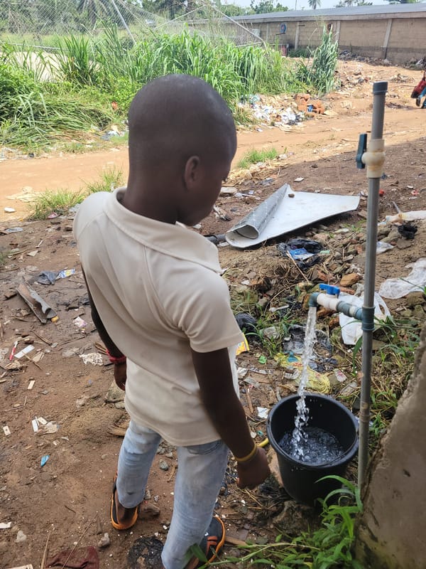 Everyday life in Egbagu, Nigeria — people, a dog, streets
