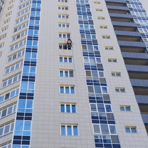 Modern high-rise building observed in Yekaterinburg during daylight